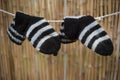 Closeup shot of striped socks hanged on the rope Royalty Free Stock Photo