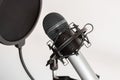 Closeup shot of studio microphone with pop filter isolated on white background Royalty Free Stock Photo