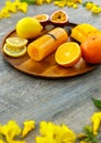 Closeup shot of summer tropical cold drink mixed juice bottle with sliced raw ripe fresh fruits mango orange lemon and passion Royalty Free Stock Photo