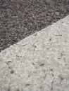 Closeup shot of a tar or asphalt pavement texture with white lines painted on asphalt road Royalty Free Stock Photo