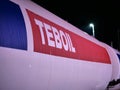 Closeup shot of the Teboil gas station sign at night