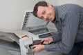 Closeup shot of technician fixing photocopier machine Royalty Free Stock Photo