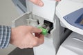 Closeup shot of technician fixing photocopier machine Royalty Free Stock Photo