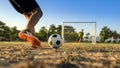 Closeup shot teen preparing to kick the ball , Royalty Free Stock Photo