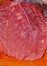 Closeup shot of the texture of a sectioned red muscle on a table