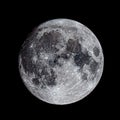 Closeup shot of a textured sparkling gray full moon in a black sky