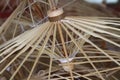 Closeup shot of thatch umbrella wooden frames