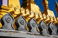 Closeup shot of Theravada Buddhist ornaments on a temple in Laos