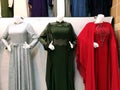 Closeup shot of three long evening dresses on mannequins