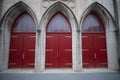 Closeup shot of three red doors with arcs in Columbia, MO Royalty Free Stock Photo