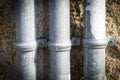 Closeup shot of three white water tubes on the wall