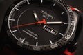 Closeup shot of a Tissot watch under dynamic lighting -