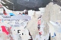 Closeup shot of the torn and ripped paper texture on the street wall