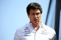 Closeup shot of Toto Wolff at an F1 competition with an exasperated expression