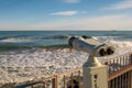 Closeup shot of tourist metal binoculars observing the sea