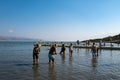 Closeup shot of tourists in the Dead Sea at Kalia Beach in Israel Royalty Free Stock Photo