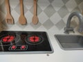 Closeup shot of toy kitchen utensils set up on a kiddy indoor playground