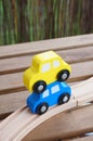 Closeup shot of toy wooden cars near a wooden track Royalty Free Stock Photo