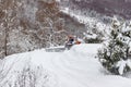 Closeup shot of the tractor clearing the road from snow Royalty Free Stock Photo