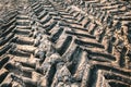 Closeup shot of tractor tire tracks on a muddy ground Royalty Free Stock Photo