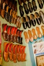 Closeup shot of traditional handmade Punjabi Jutti lether shoes hanging from the walls