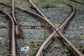 Closeup shot of train railings crossing each other to different directions