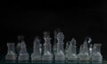 Closeup shot of transparent glass chess pieces Royalty Free Stock Photo