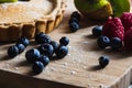 Closeup shot of treacle tart with blueberry, raspberriy and kiwi Royalty Free Stock Photo