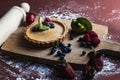 Closeup shot of treacle tart with blueberry, raspberry, strawberry and kiwi Royalty Free Stock Photo