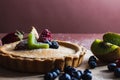 Closeup shot of treacle tart with blueberry, raspberry, strawberry and kiwi Royalty Free Stock Photo