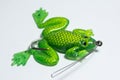 Closeup shot of a trinket with a big frog isolated on a white background Royalty Free Stock Photo