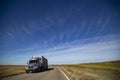 Closeup shot of a truck driving on the empty roads in middle America
