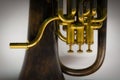Closeup shot of a tuba musical instrument valves and the mouthpiece Royalty Free Stock Photo