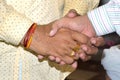 Closeup shot of two businessmen shaking hands together Royalty Free Stock Photo