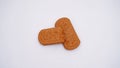 Closeup shot of two cracker biscuits isolated on a white background Royalty Free Stock Photo