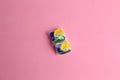 Closeup shot of two dishwasher tablets on pink background