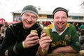 Closeup shot of two happy male friends posing enjoying a beer together