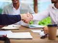 Its a deal. Closeup shot of two unrecognizable businesspeople shaking hands during a meeting in the boardroom. Royalty Free Stock Photo