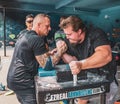 Closeup shot of two young males arm wrestling in Vancouver arm wrestling club practice