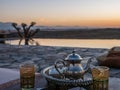 closeup shot of a typical Moroccan mint tea set on the table in  Agafay desert, Marrakech Royalty Free Stock Photo