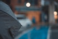 Closeup shot of an umbrella covered with raindrops on a blurred background