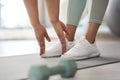 Bend down and touch your feet. Closeup shot of an unrecognisable woman stretching to touch her toes while exercising at Royalty Free Stock Photo