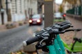 Closeup shot of the upper part of electric scooters parked outside on a street