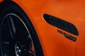 Closeup shot of the V8 BITURBO on a luxury Mercedes-Benz AMG SL with orange color Royalty Free Stock Photo