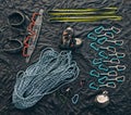 Closeup shot of a variety of carabiner hooks, rope, and other safety equipment used for rock or mountain climbing