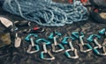 Closeup shot of a variety of carabiner hooks, rope, and other safety equipment used for rock or mountain climbing Royalty Free Stock Photo