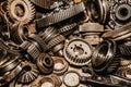 Closeup shot of various grey metallic gears and parts on a work table