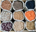 Closeup shot of various legumes in eco bags Royalty Free Stock Photo