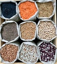 Closeup shot of various legumes in eco bags Royalty Free Stock Photo