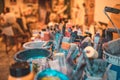 Closeup shot of various paintbrushes, tubes of paint, artistic tools and equipment in a studio